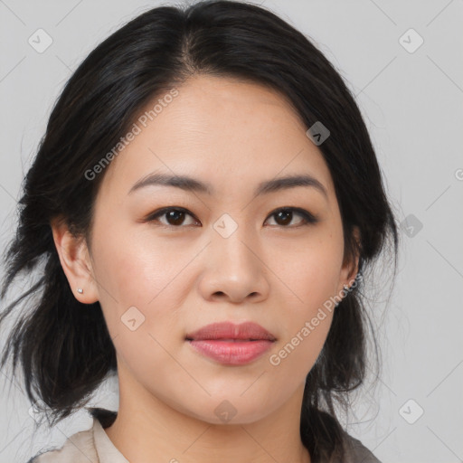 Joyful asian young-adult female with medium  black hair and brown eyes