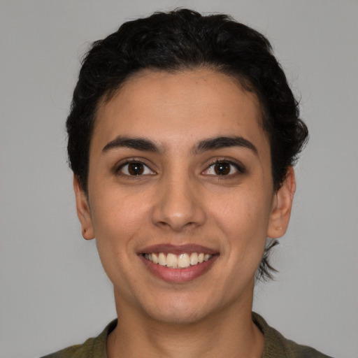 Joyful white young-adult female with short  brown hair and brown eyes