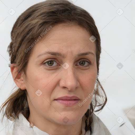 Joyful white adult female with medium  brown hair and grey eyes