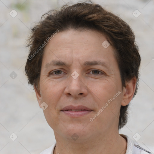 Joyful white adult female with short  brown hair and brown eyes