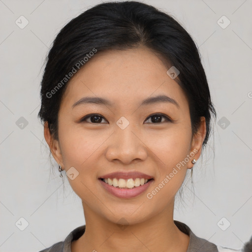 Joyful asian young-adult female with medium  black hair and brown eyes