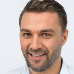 Joyful white adult male with short  brown hair and brown eyes