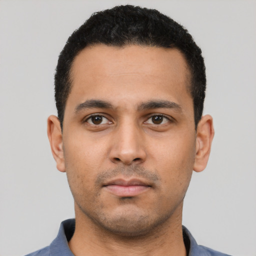 Neutral latino young-adult male with short  black hair and brown eyes