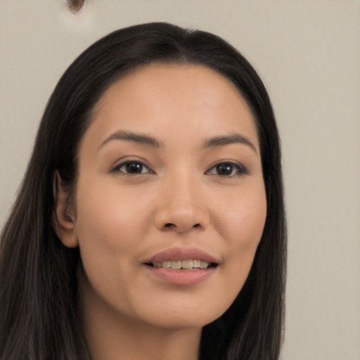 Joyful latino young-adult female with long  black hair and brown eyes