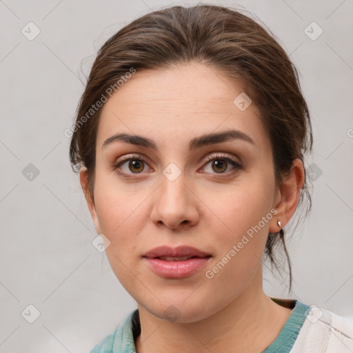 Joyful white young-adult female with medium  brown hair and green eyes