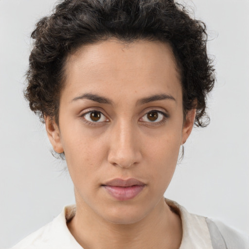 Neutral white young-adult female with short  brown hair and brown eyes