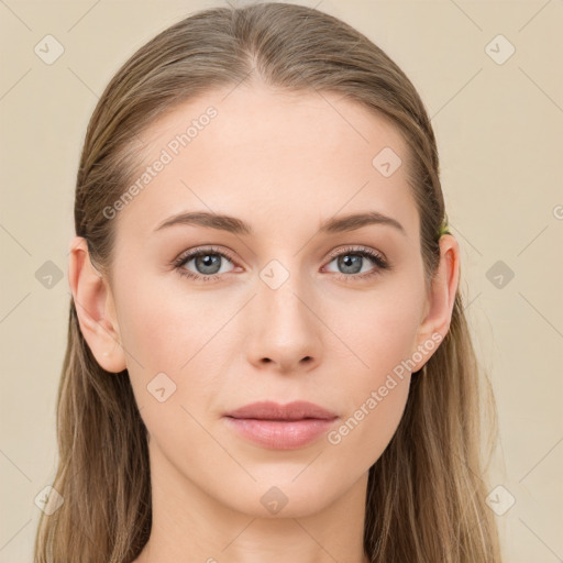 Joyful white young-adult female with long  brown hair and blue eyes