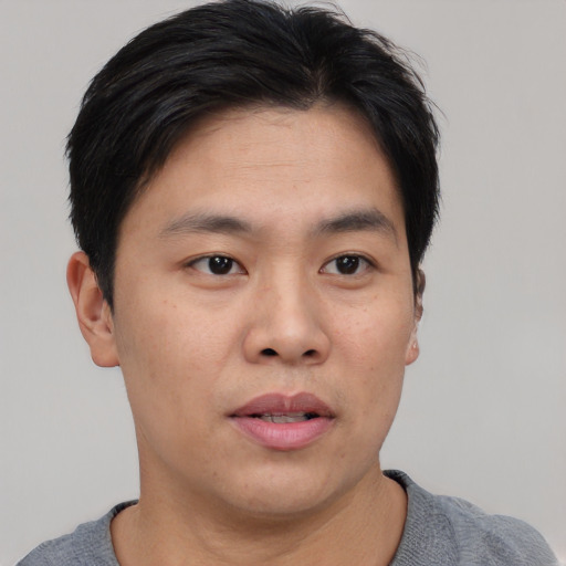 Neutral asian young-adult male with short  black hair and brown eyes
