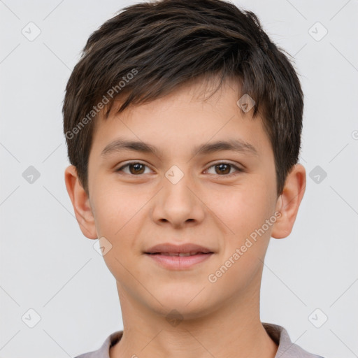 Joyful white child male with short  brown hair and brown eyes