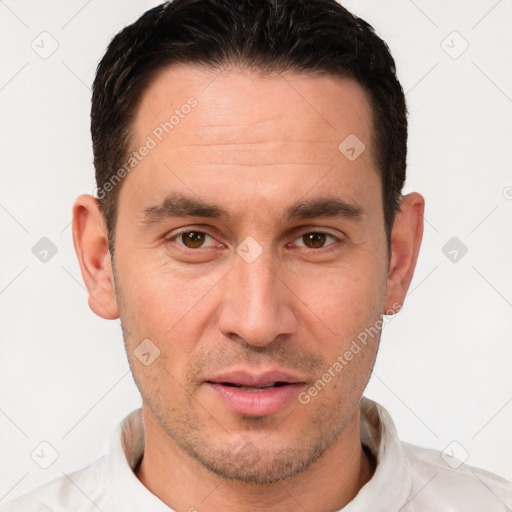 Joyful white adult male with short  brown hair and brown eyes