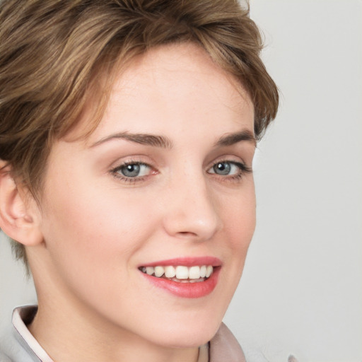 Joyful white young-adult female with short  brown hair and grey eyes