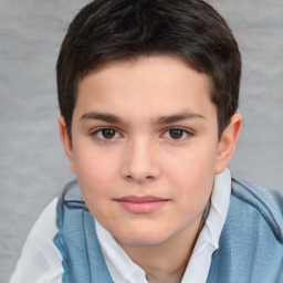 Joyful white child male with short  brown hair and brown eyes