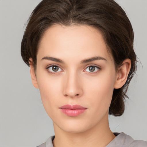 Neutral white young-adult female with medium  brown hair and brown eyes