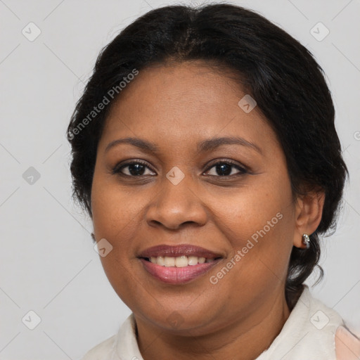 Joyful black adult female with medium  brown hair and brown eyes