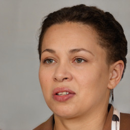 Joyful white adult female with short  brown hair and brown eyes