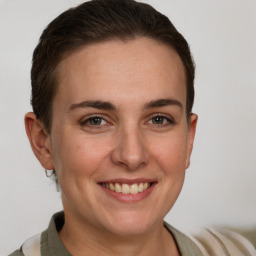 Joyful white adult female with short  brown hair and brown eyes