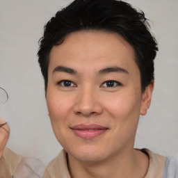 Joyful asian young-adult male with short  brown hair and brown eyes