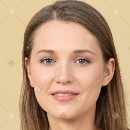 Joyful white young-adult female with long  brown hair and grey eyes