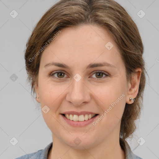 Joyful white young-adult female with medium  brown hair and grey eyes