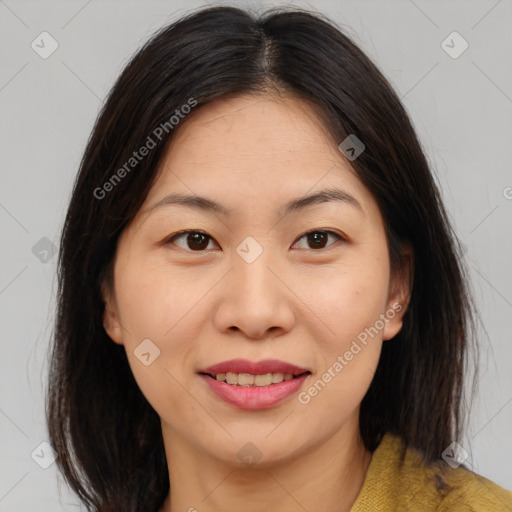 Joyful asian young-adult female with medium  brown hair and brown eyes