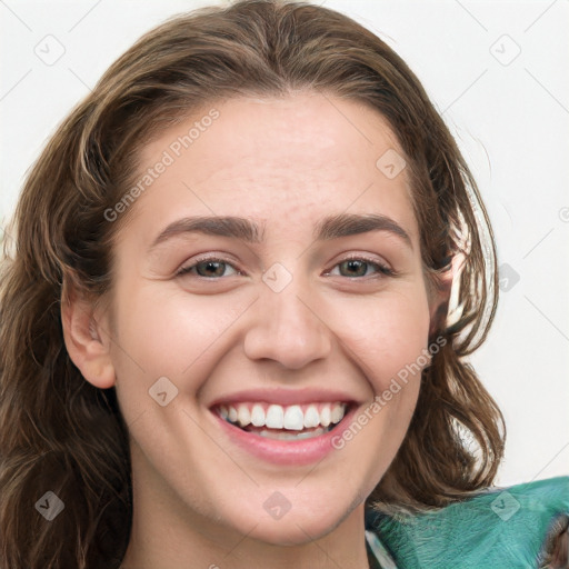 Joyful white young-adult female with long  brown hair and green eyes