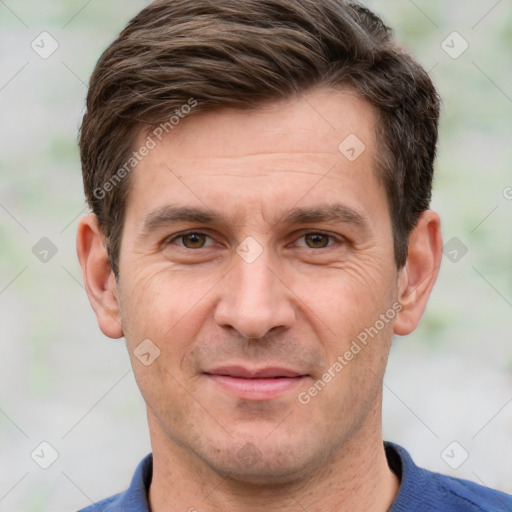 Joyful white adult male with short  brown hair and grey eyes