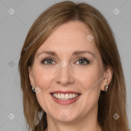 Joyful white adult female with medium  brown hair and grey eyes