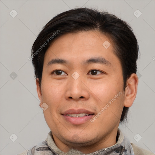 Joyful asian young-adult male with short  brown hair and brown eyes