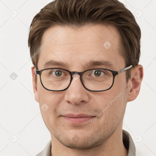 Joyful white adult male with short  brown hair and grey eyes