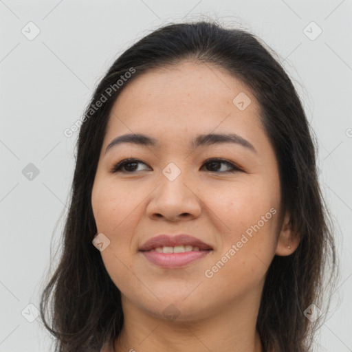 Joyful asian young-adult female with long  brown hair and brown eyes