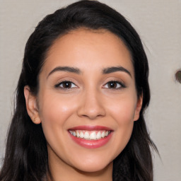 Joyful white young-adult female with long  black hair and brown eyes