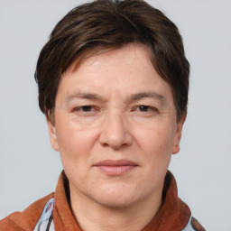 Joyful white adult female with short  brown hair and brown eyes