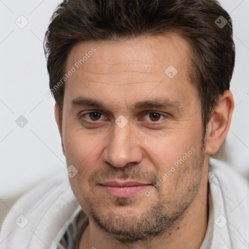 Joyful white adult male with short  brown hair and brown eyes