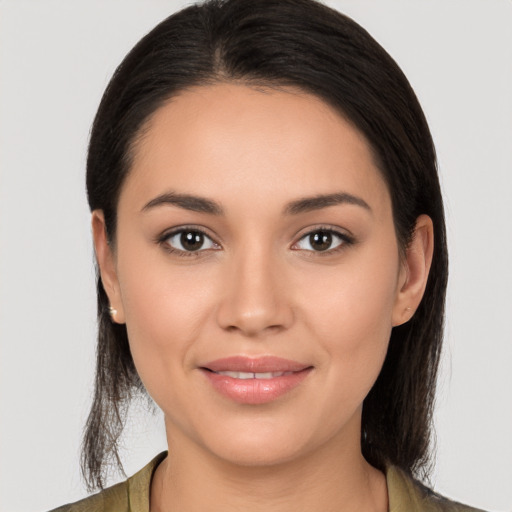 Joyful white young-adult female with long  black hair and brown eyes