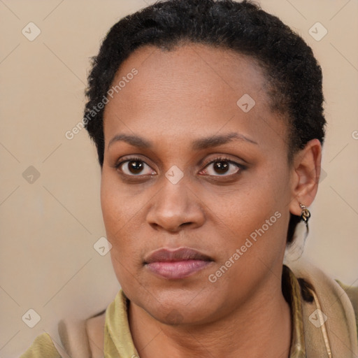 Joyful latino young-adult female with short  brown hair and brown eyes