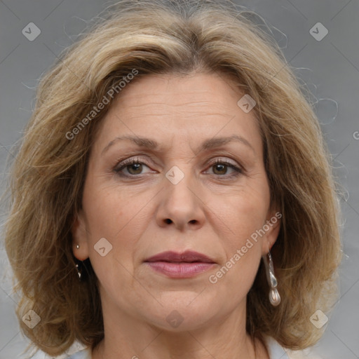 Joyful white adult female with medium  brown hair and grey eyes