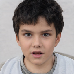 Joyful white child male with short  brown hair and brown eyes