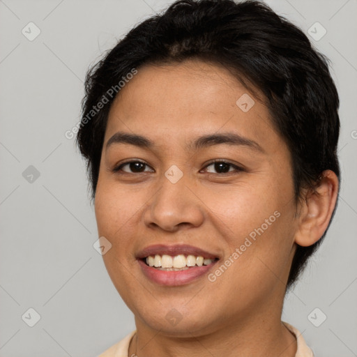 Joyful asian young-adult female with short  brown hair and brown eyes