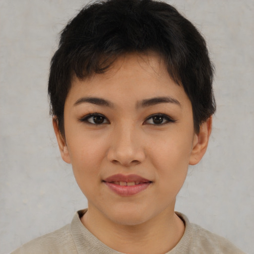 Joyful asian young-adult female with short  brown hair and brown eyes