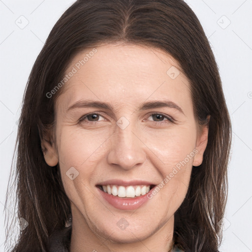 Joyful white young-adult female with long  brown hair and brown eyes