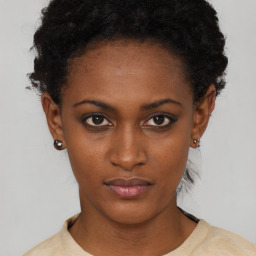 Neutral black young-adult female with short  black hair and brown eyes