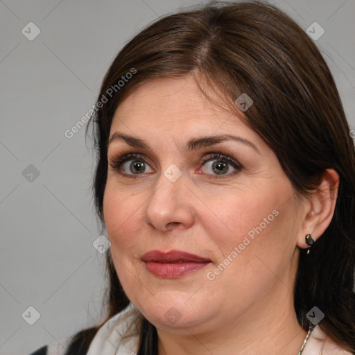 Joyful white adult female with medium  brown hair and grey eyes