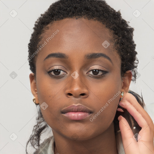 Neutral black young-adult female with short  brown hair and brown eyes