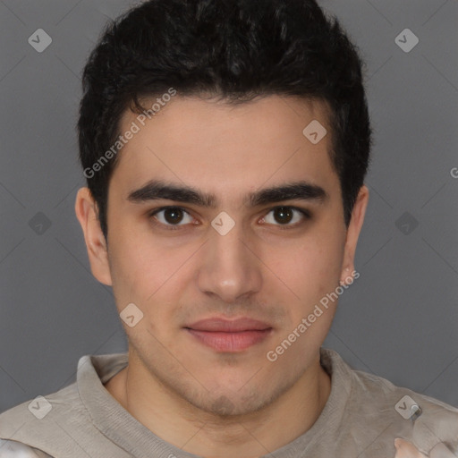 Joyful latino young-adult male with short  brown hair and brown eyes