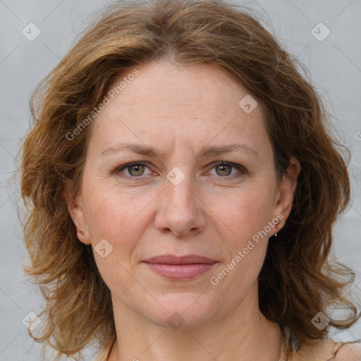 Joyful white adult female with medium  brown hair and grey eyes