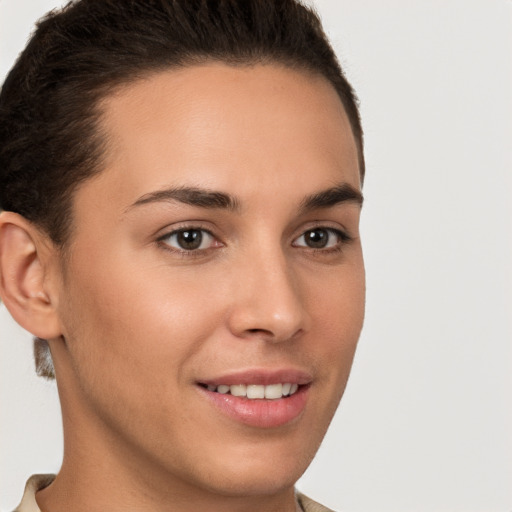 Joyful white young-adult female with short  brown hair and brown eyes