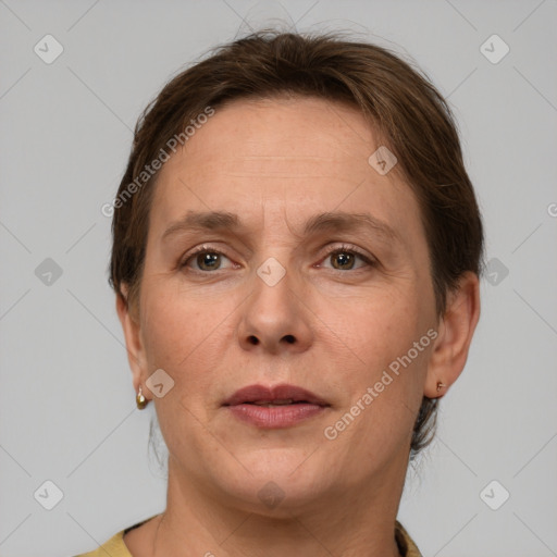 Joyful white adult female with short  brown hair and grey eyes