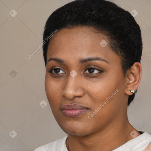 Joyful black young-adult female with short  black hair and brown eyes