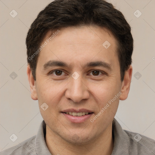 Joyful white adult male with short  brown hair and brown eyes