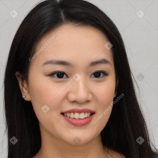 Joyful asian young-adult female with long  brown hair and brown eyes